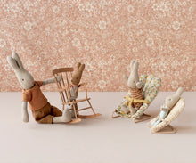 Load image into Gallery viewer, Three plush toy rabbits in various poses against a floral wallpaper background