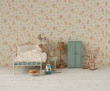 Load image into Gallery viewer, Miniature bedroom setup with floral wallpaper, dollhouse furniture, and decorative items.