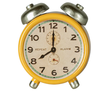Load image into Gallery viewer, Vintage-style alarm clock with yellow casing and silver knobs on a white background
