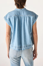 Load image into Gallery viewer, Light blue denim vest worn by a person on a plain background
