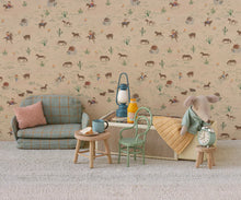 Load image into Gallery viewer, Children's room with patterned wallpaper, furniture, and toys.