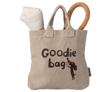 Load image into Gallery viewer, Textile goodie bag with a rolled-up blanket and wooden toy on a white background
