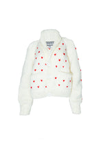 Load image into Gallery viewer, An off-white knit cardigan sweater featuring small red heart patterns and a high ribbed collar, displayed against a plain white background.