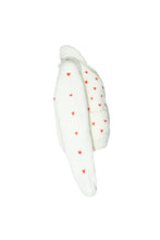 Load image into Gallery viewer, An off-white knit cardigan sweater with small red heart patterns, shown from a side profile view against a plain white background.