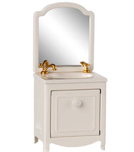 Load image into Gallery viewer, White bathroom vanity with mirror and gold fixtures on a white background