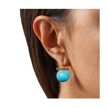 Load image into Gallery viewer, A person wearing a pair of pebble blue pearl earrings with a gold-colored wire.